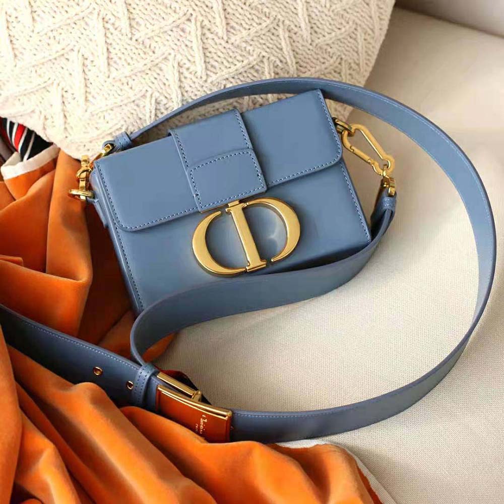 Side profile of Dior Women 30 Montaigne Box Bag Denim Blue leather texture