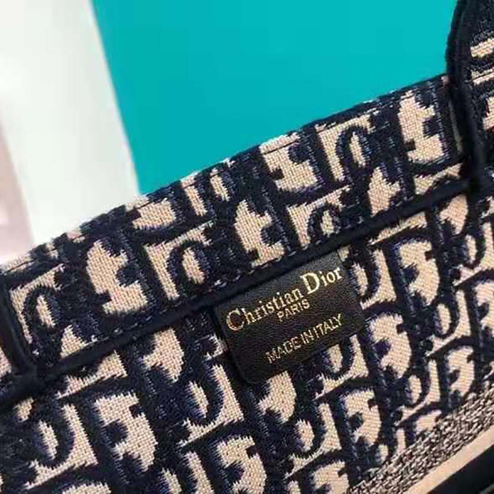 Side angle showing silver-tone hardware on Dior Women Catherine Tote Bag