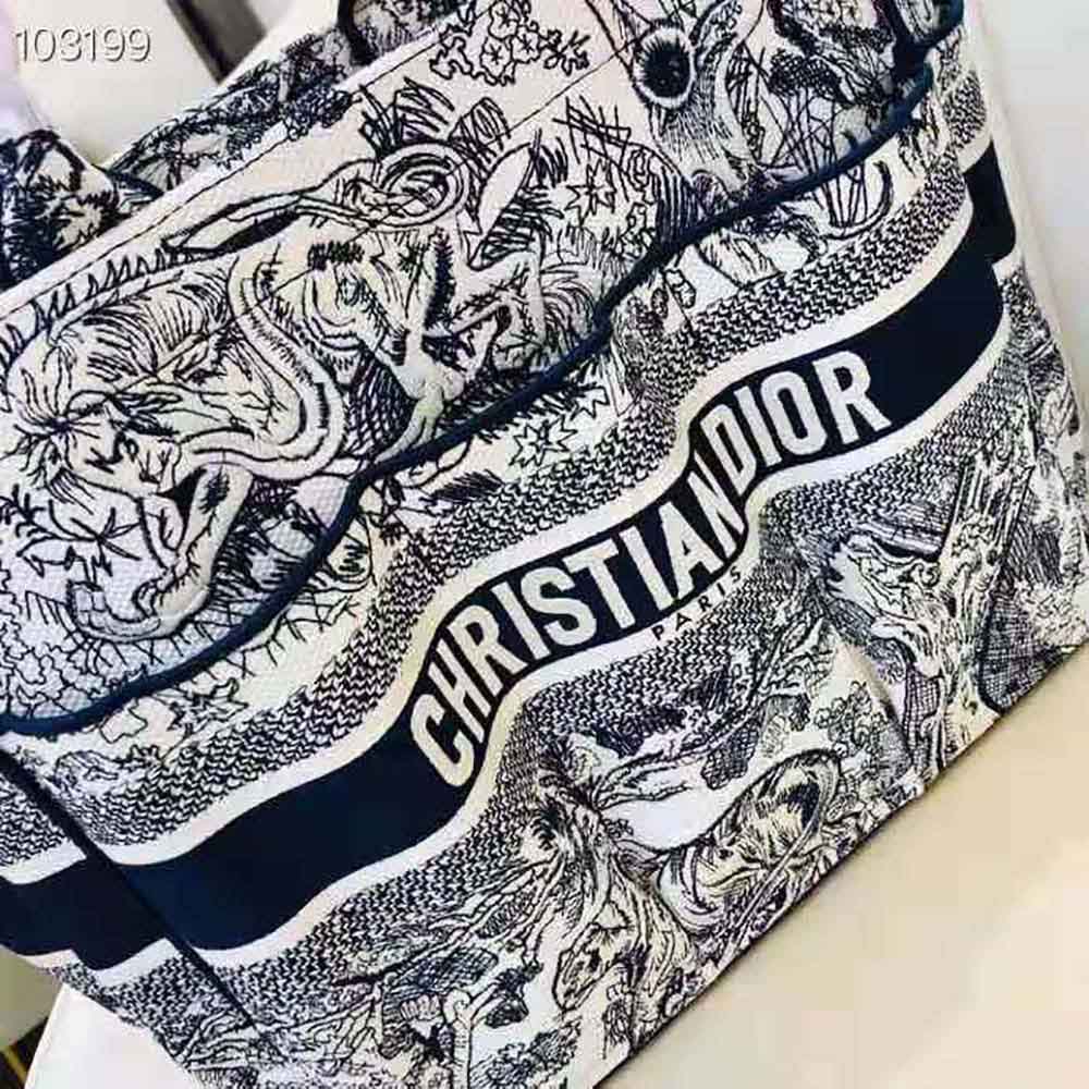 Side angle showing gold hardware on Dior Women Catherine Tote Blue Toile de Jouy Embroidery
