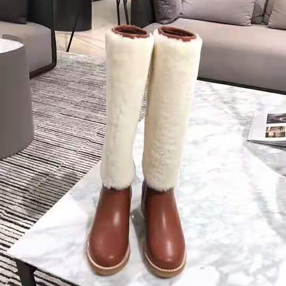 Close-up on brass Dior hardware and shearling lining detail