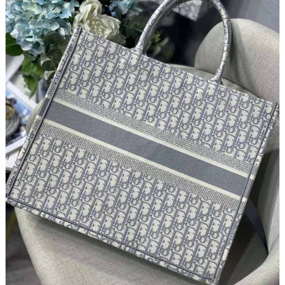 Side angle showing structured silhouette of Dior Women Dior Bbook Tote-Silver