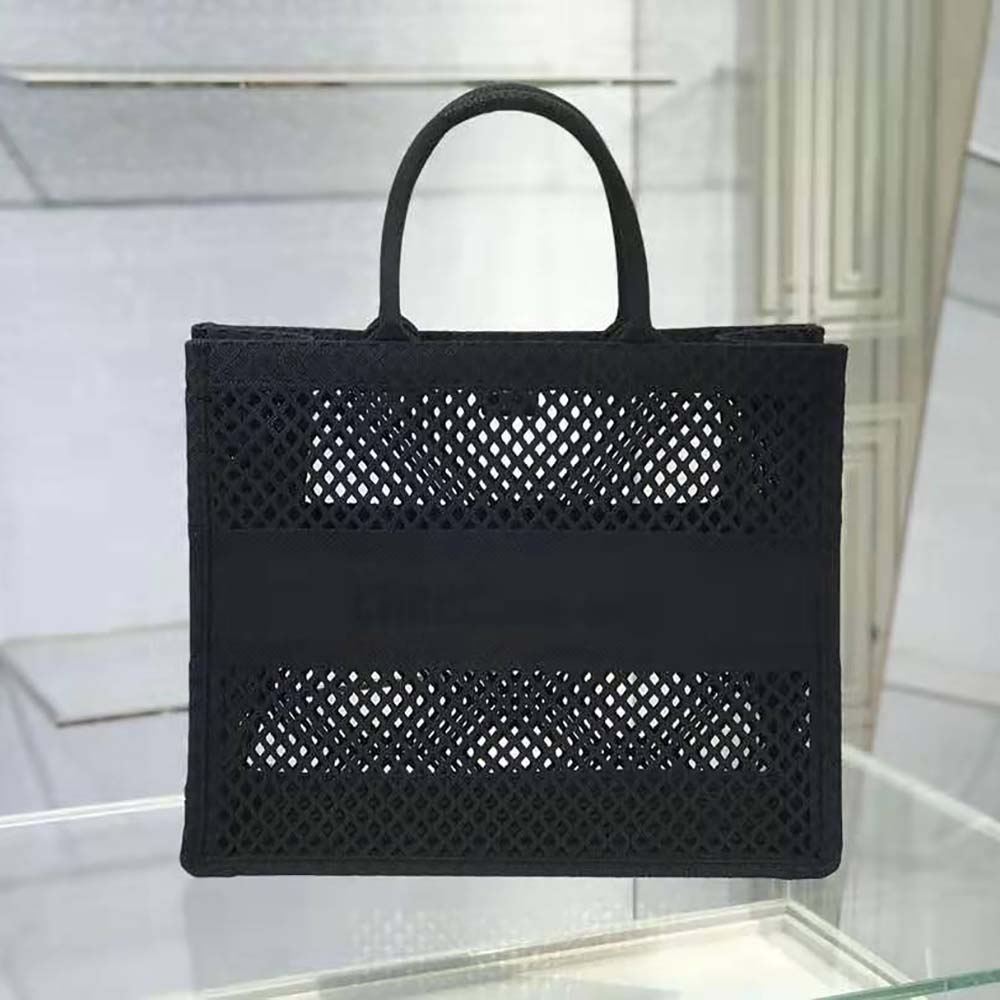 Close-up showing black mesh embroidery and silver hardware