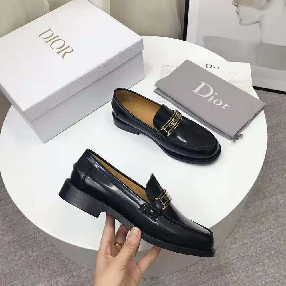 Close-up of glossy black glazed calfskin on Dior Code Loafer