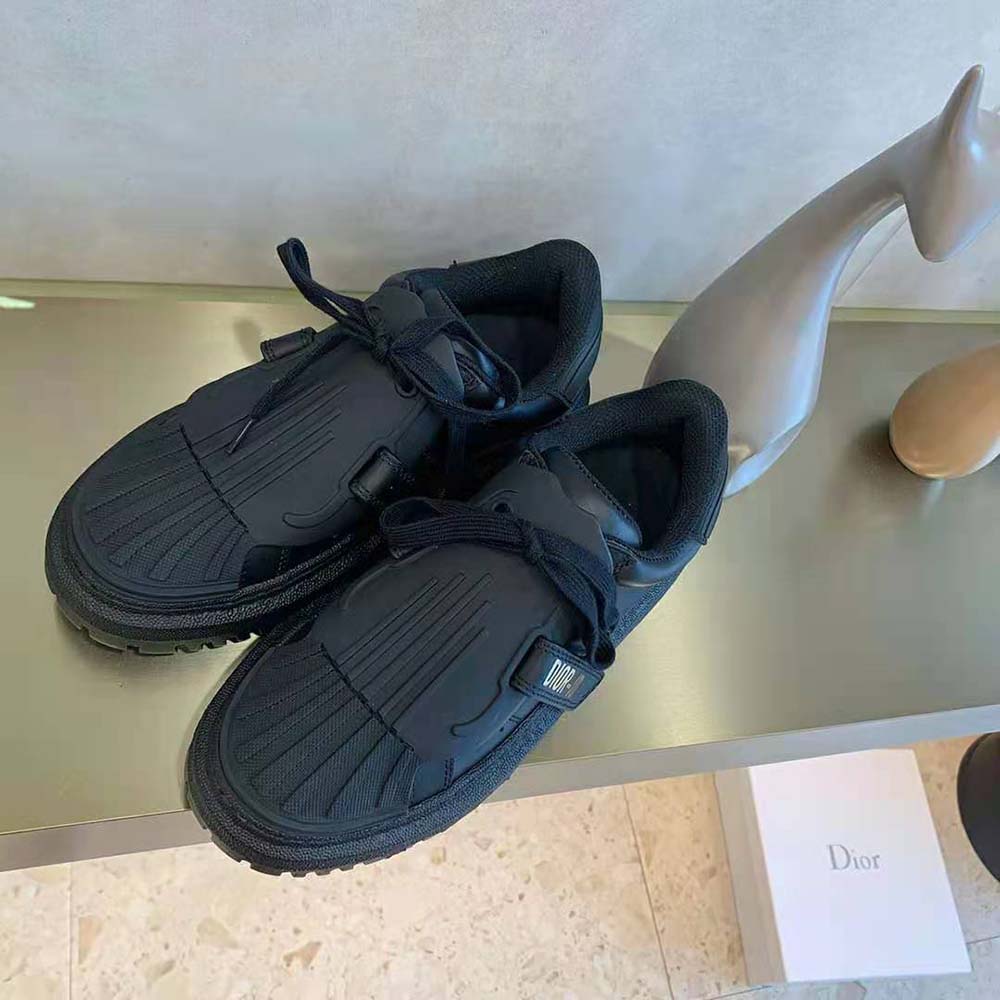 Close-up of black calfskin and rubber sole on Dior Women Dior-Id Sneaker