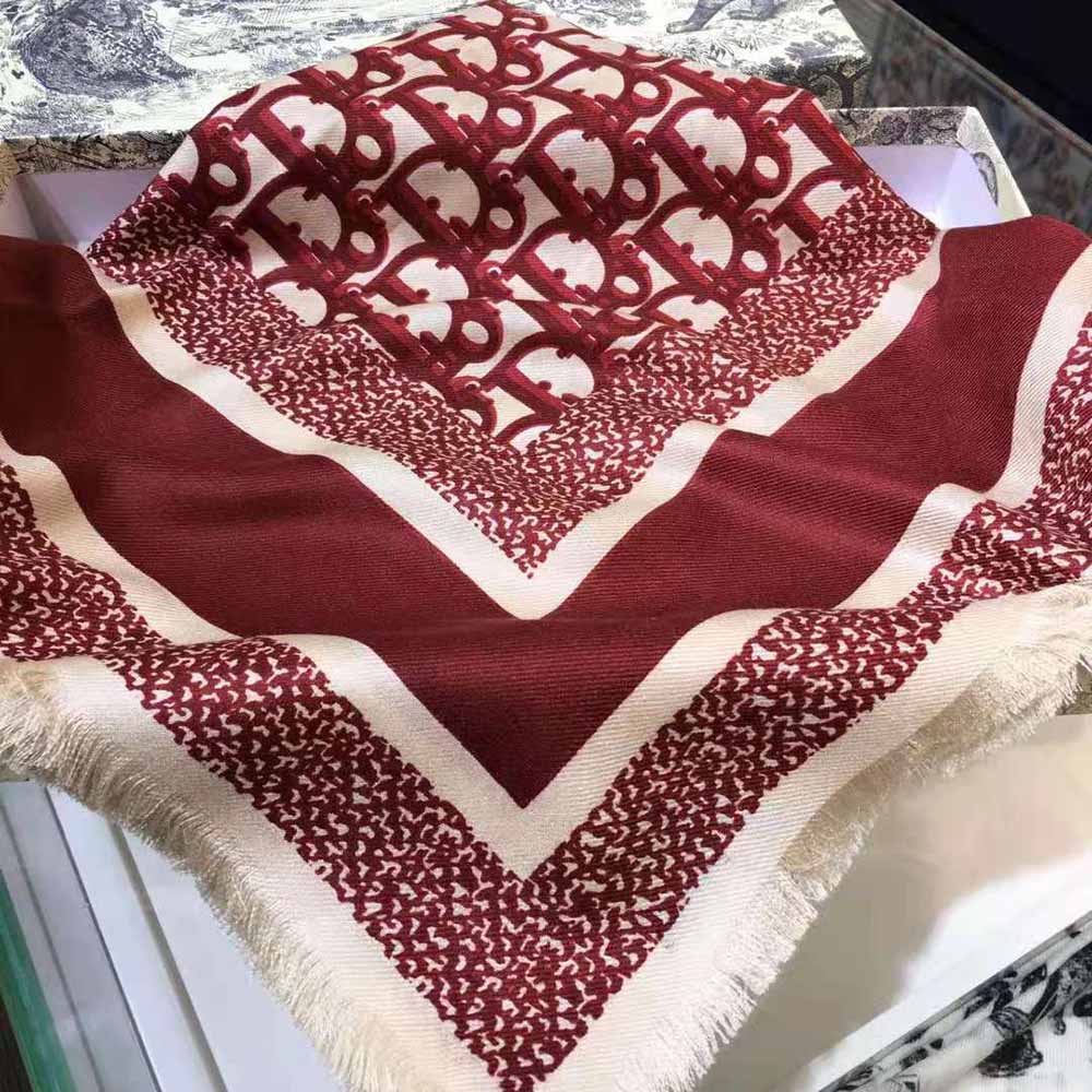 Close-up of maroon silk twill texture on Dior Women Dior Oblique Square Scarf
