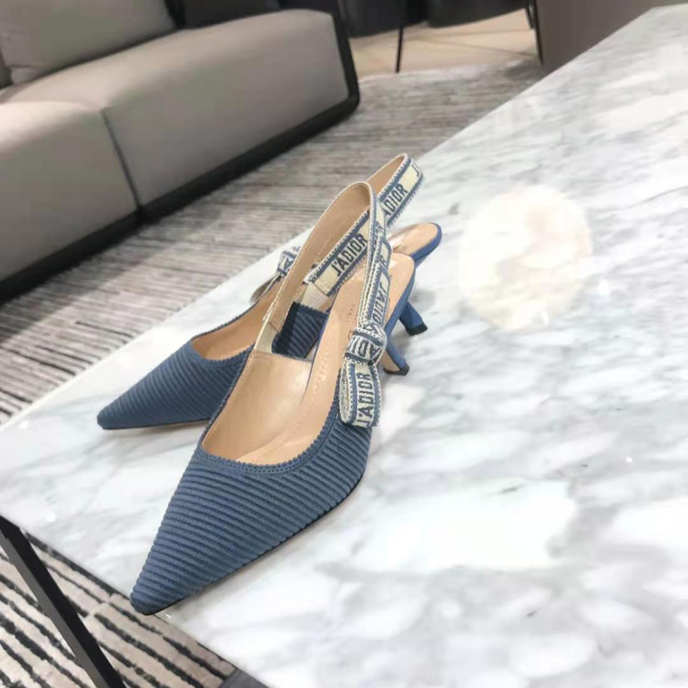 Rear angle showing adjustable slingback and metal logo on Dior pump