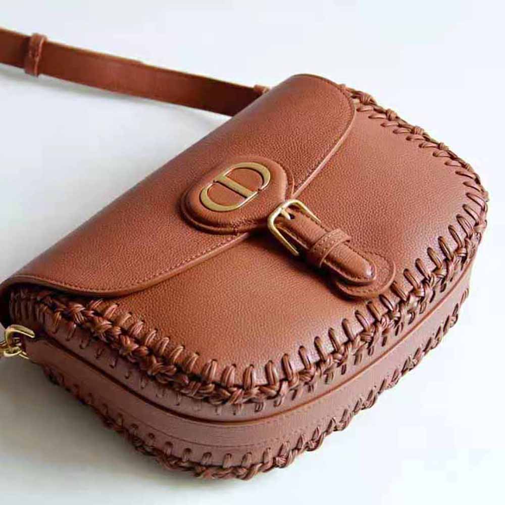 Side angle showing medium size and adjustable strap of Dior Women Medium Dior Bobby Bag