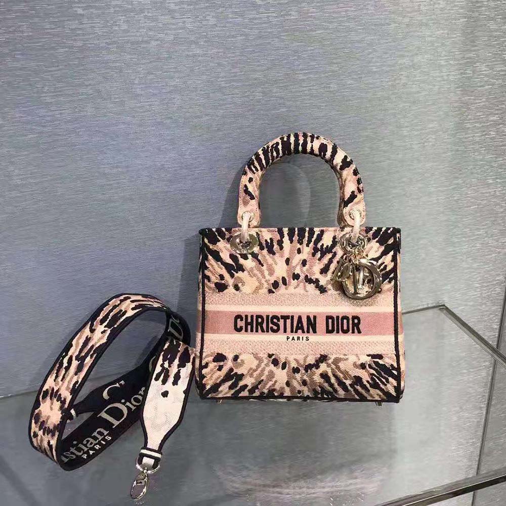 Close-up of multicolor tie pattern and Dior embroidery details