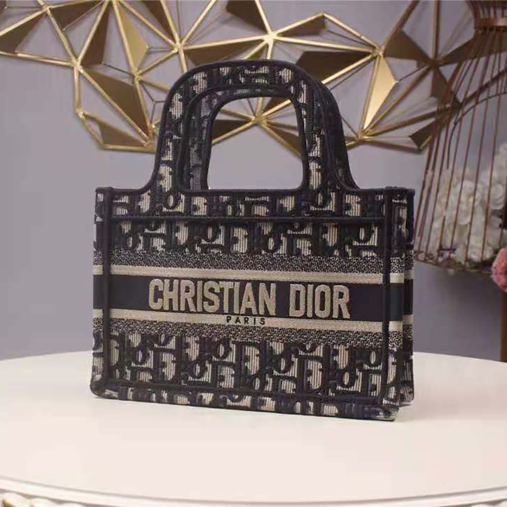 Close-up detail of blue Dior Oblique embroidery on Mini Dior Book Tote