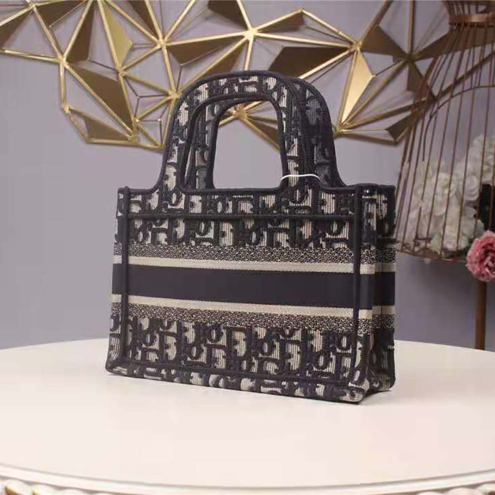 Side profile showing silver-tone hardware on Dior Women Mini Dior Book Tote