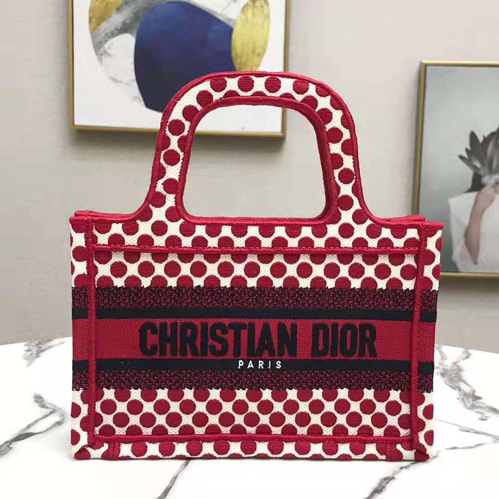 Close-up of red embroidered Dior dots on Mini Dioramour Dior Book Tote canvas
