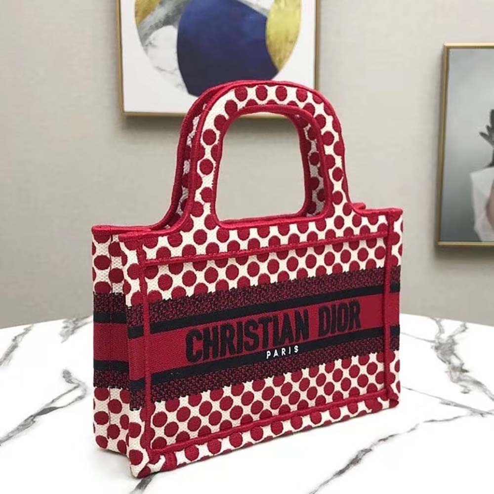 Side angle showing silver hardware and zipper of Mini Dioramour Dior Book Tote