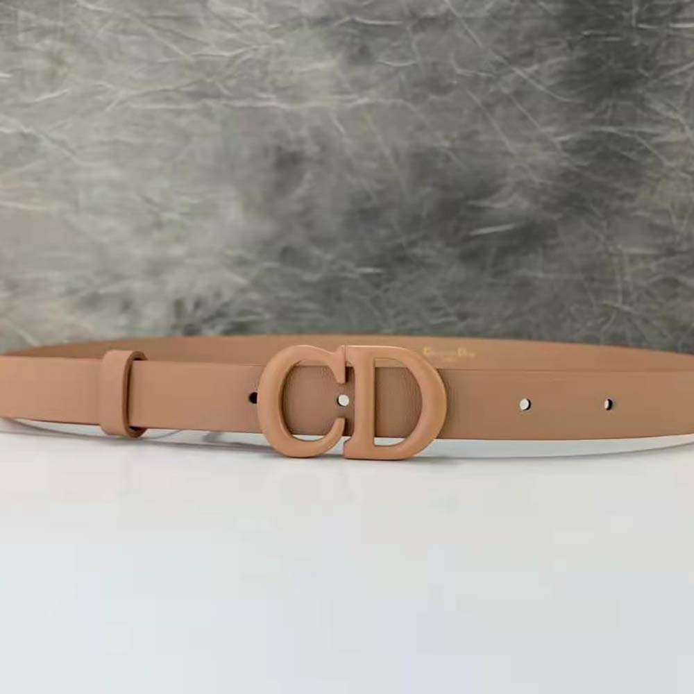 Close-up of pink matte calfskin and gold Dior signature detail