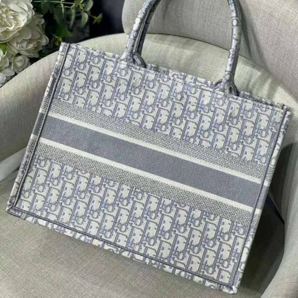 Side angle showing structured silhouette of Dior Women Small Dior Bbook Tote-Silver