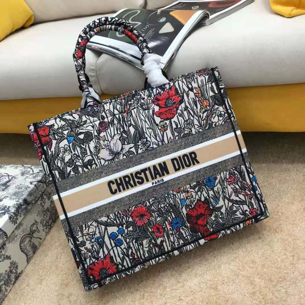 Close-up of vibrant floral embroidery on Small Dior Book Tote in red
