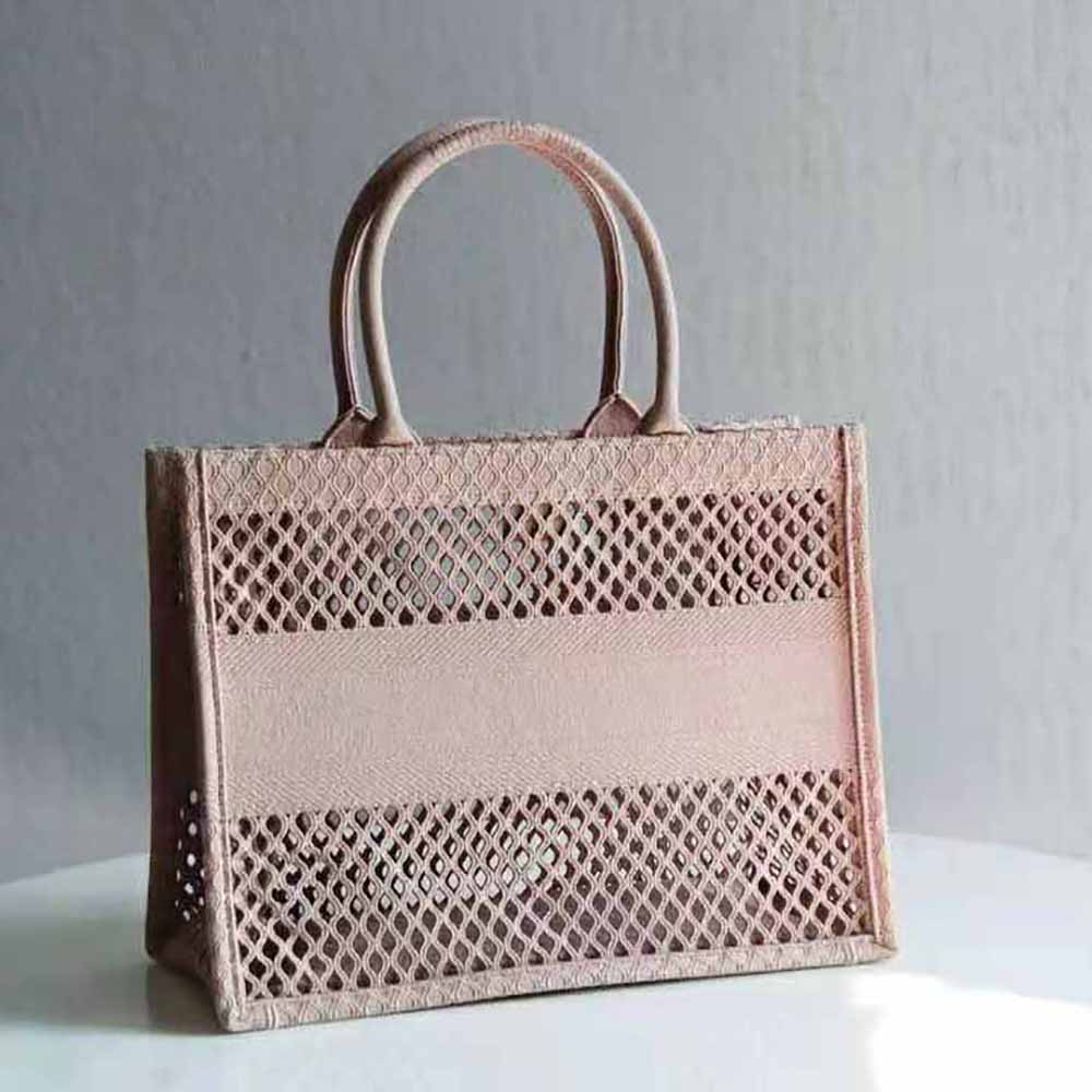 Side angle showing silver hardware on Dior Women Small Book Tote