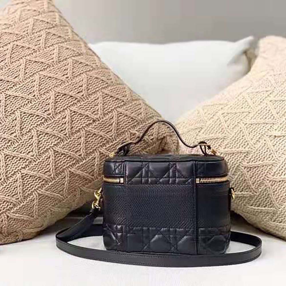Close-up of Cannage quilting and gold hardware on Dior travel vanity case
