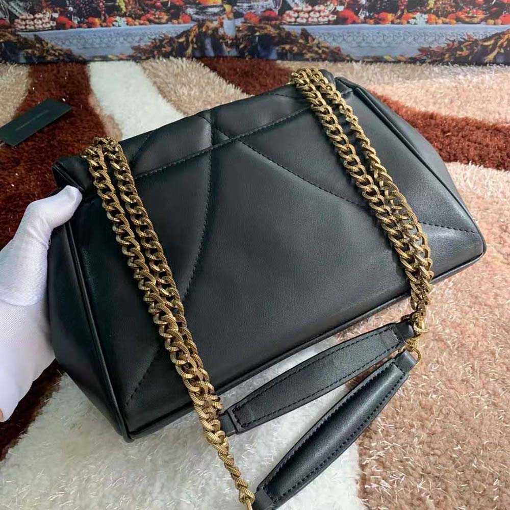 Side angle showing gold clasp and strap on Dolce Gabbana D&G large shoulder bag
