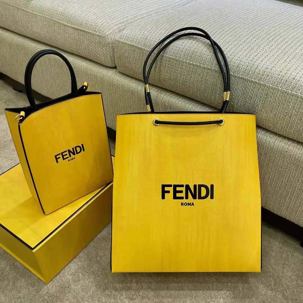 Close-up of gold-tone hardware on Fendi Men Fendi Pack Medium Shopping Bag Yellow Leather Bag