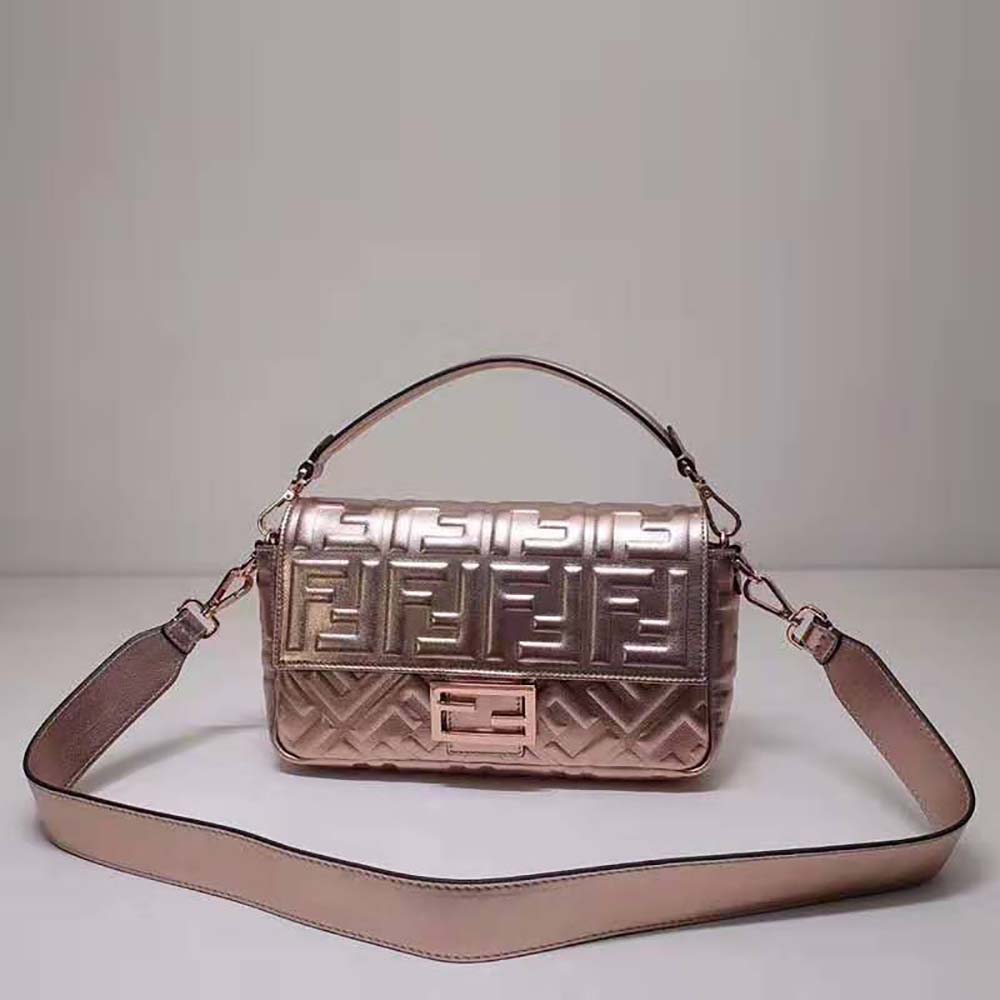 Close-up of gold FF logo hardware on pink Fendi Women Baguette Bag