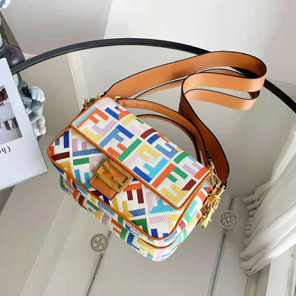 Close-up of gold-tone hardware on Fendi Women Baguette Beige Canvas Bag