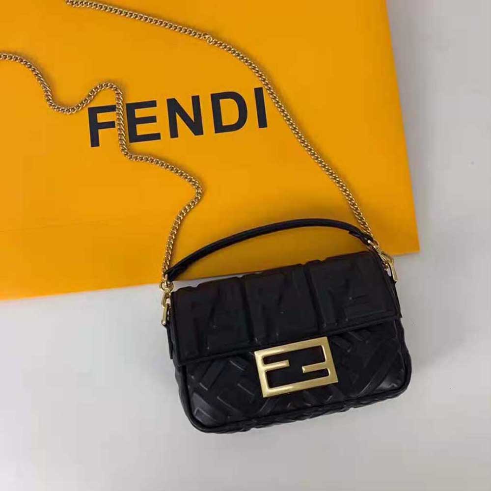 Close-up of gold hardware on Fendi Women Baguette Black Leather Bag