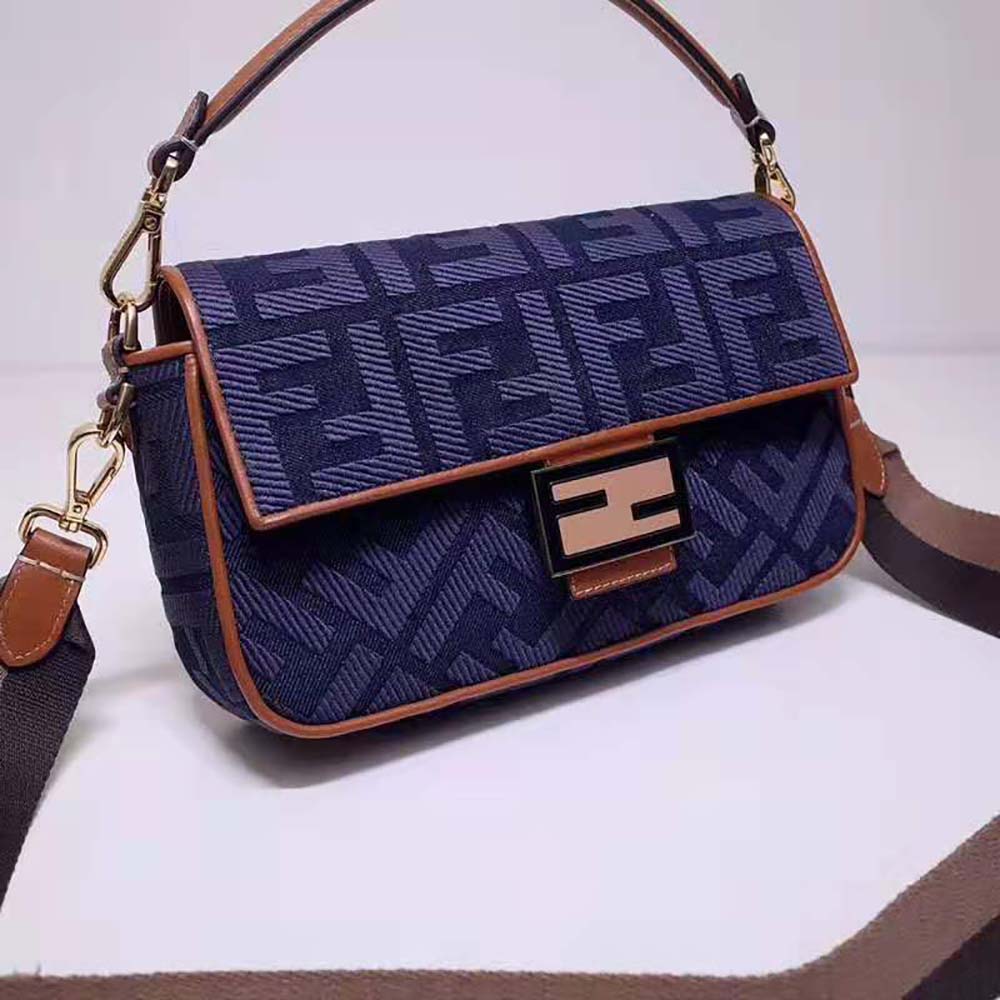 Side angle of Fendi Women Baguette Blue Denim Bag with visible strap