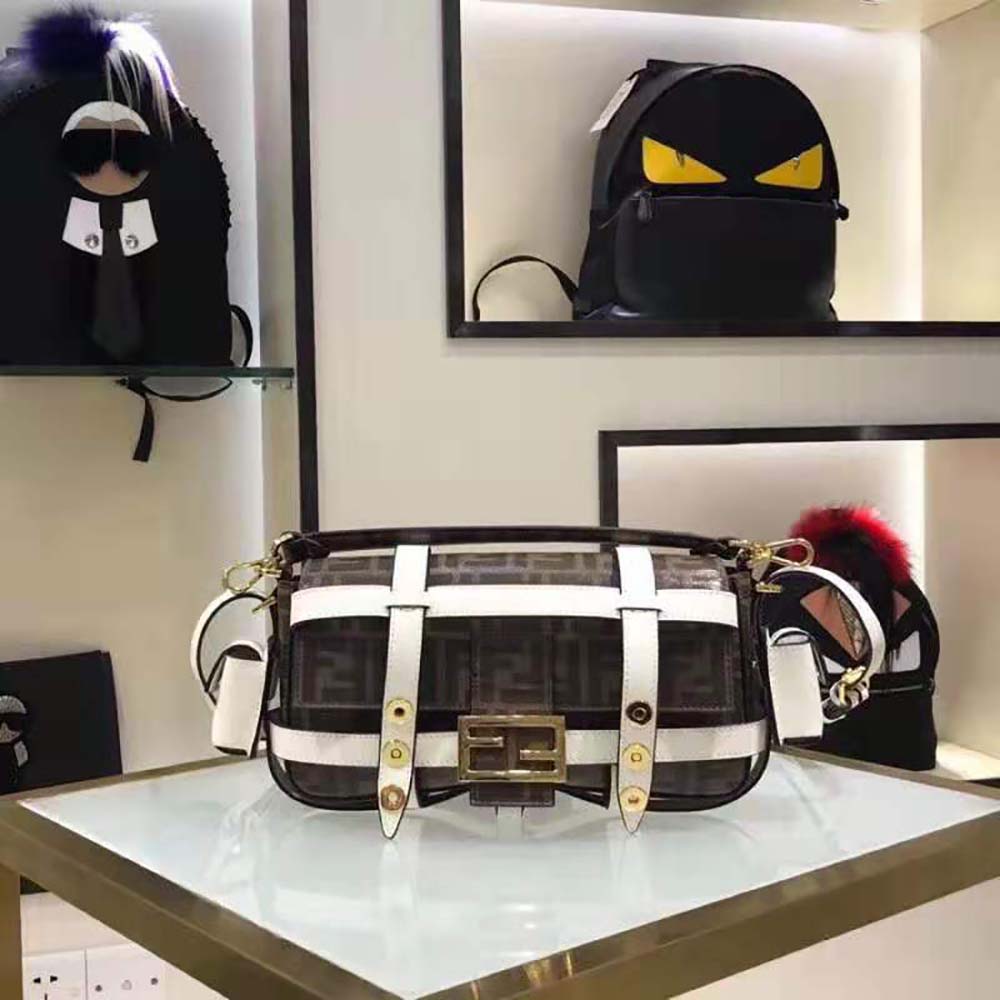 Close-up detail of gold-tone hardware on Fendi Women Baguette Cage Brown Fabric Bag-White