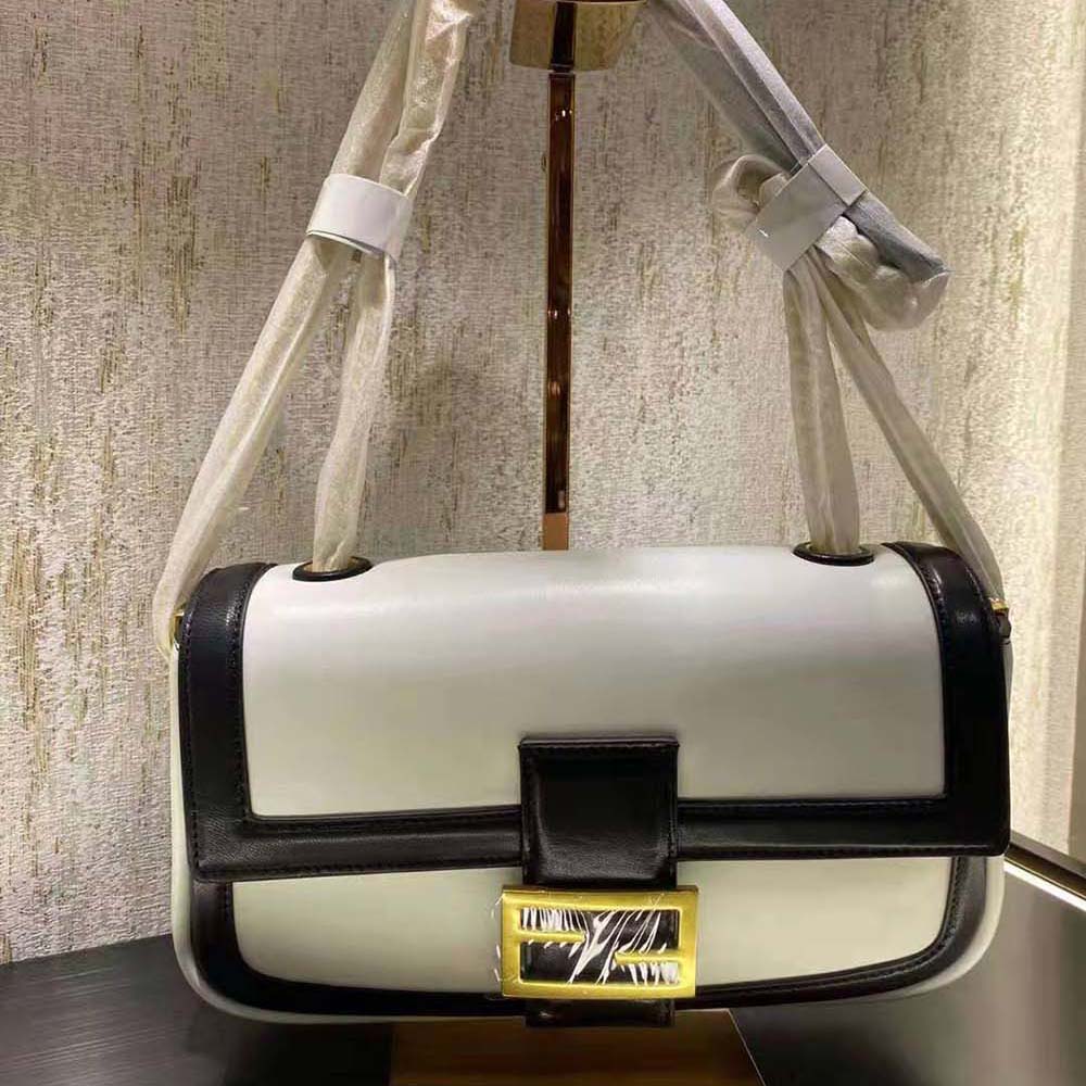 Close-up of silver chain strap on Fendi Women Baguette Chain Black and White Nappa Leather Bag