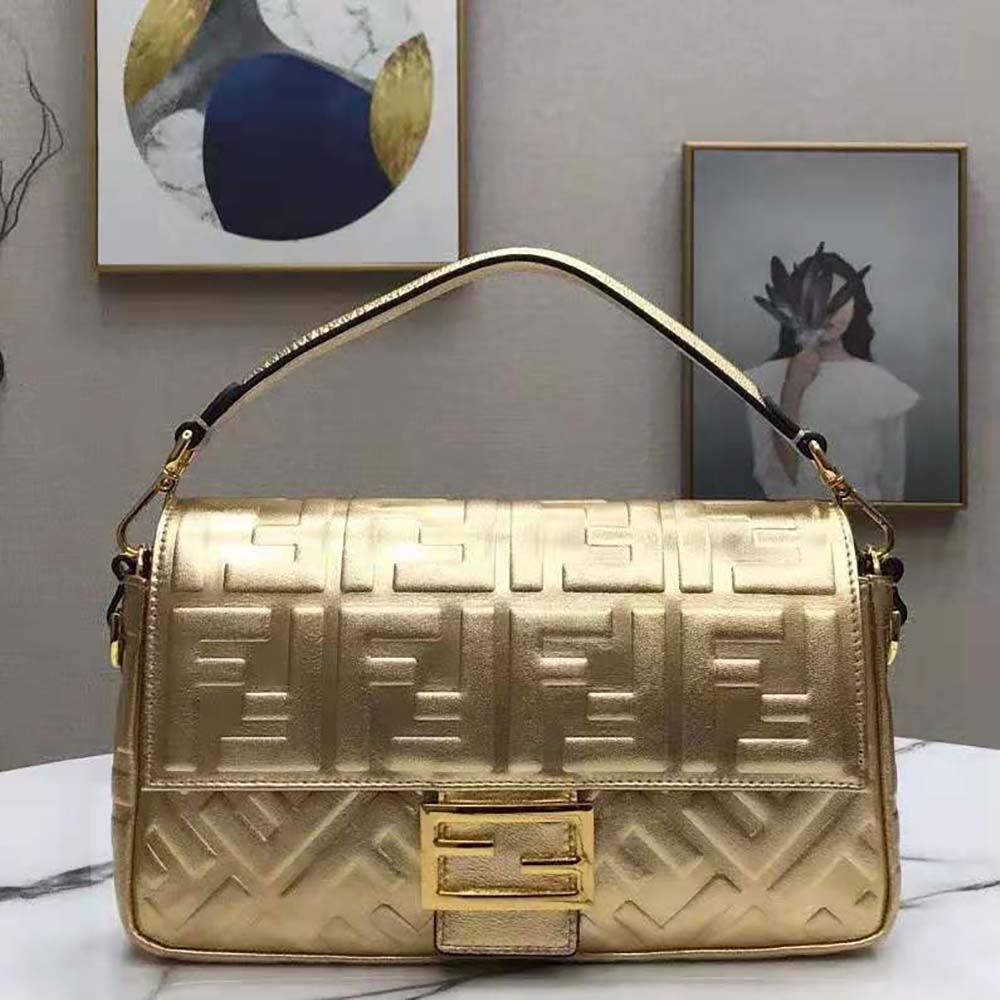 Close-up of gold hardware on Fendi Women Baguette Fendi Prints On Leather Bag-Gold