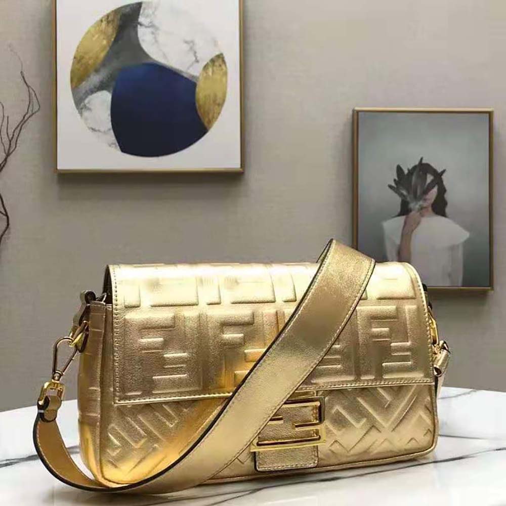Side profile showing leather texture on Fendi Women Baguette Fendi Prints On Leather Bag-Gold