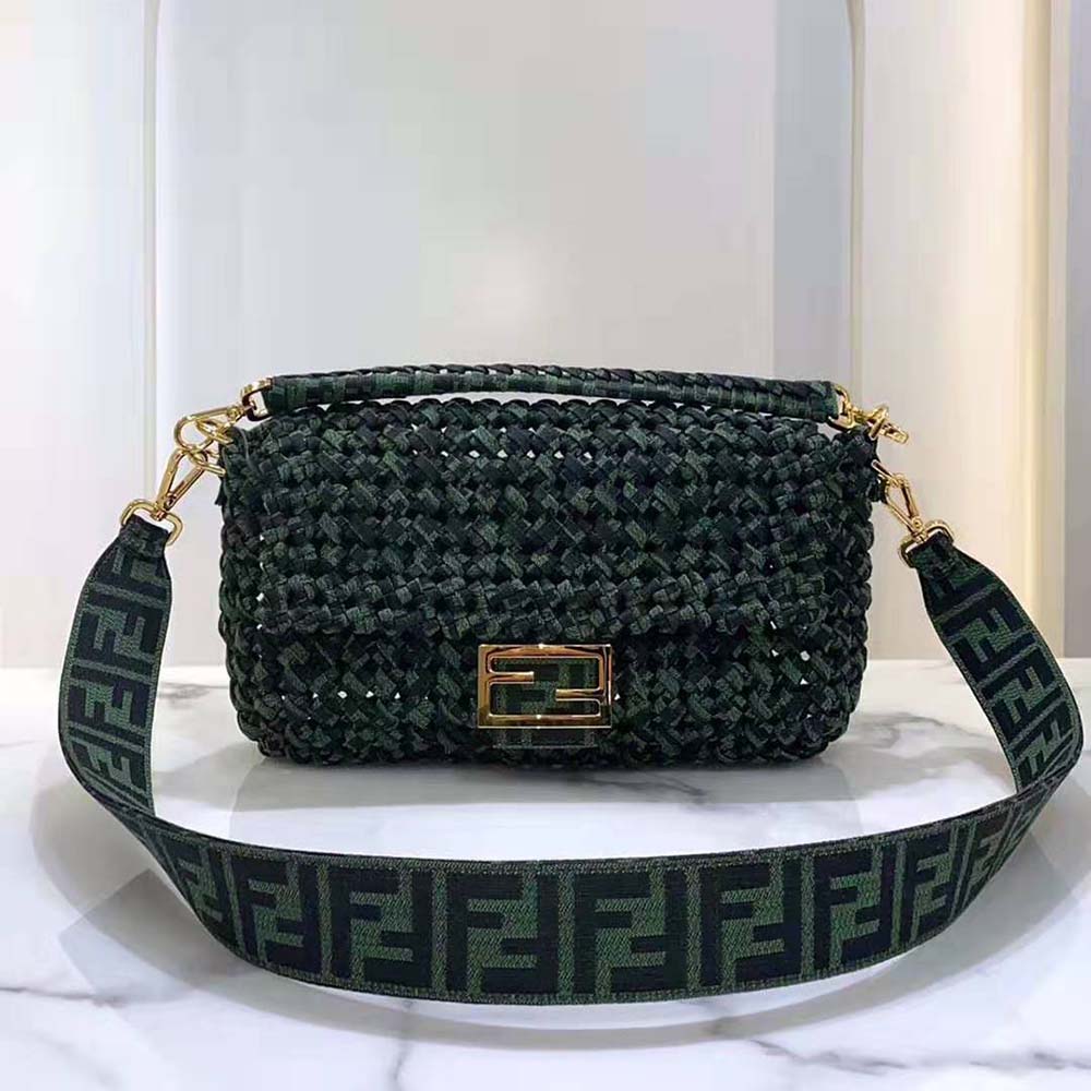 Close-up on green jacquard fabric and interlaced detail of Fendi bag