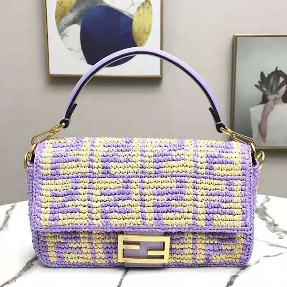 Close-up of gold-tone hardware on Fendi Women Baguette Large Lilac FF Raffia Bag