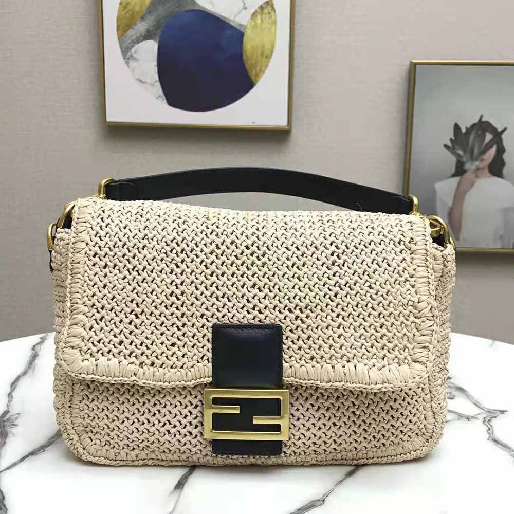 Close-up of gold-tone hardware on Fendi Women Baguette Straw Bag