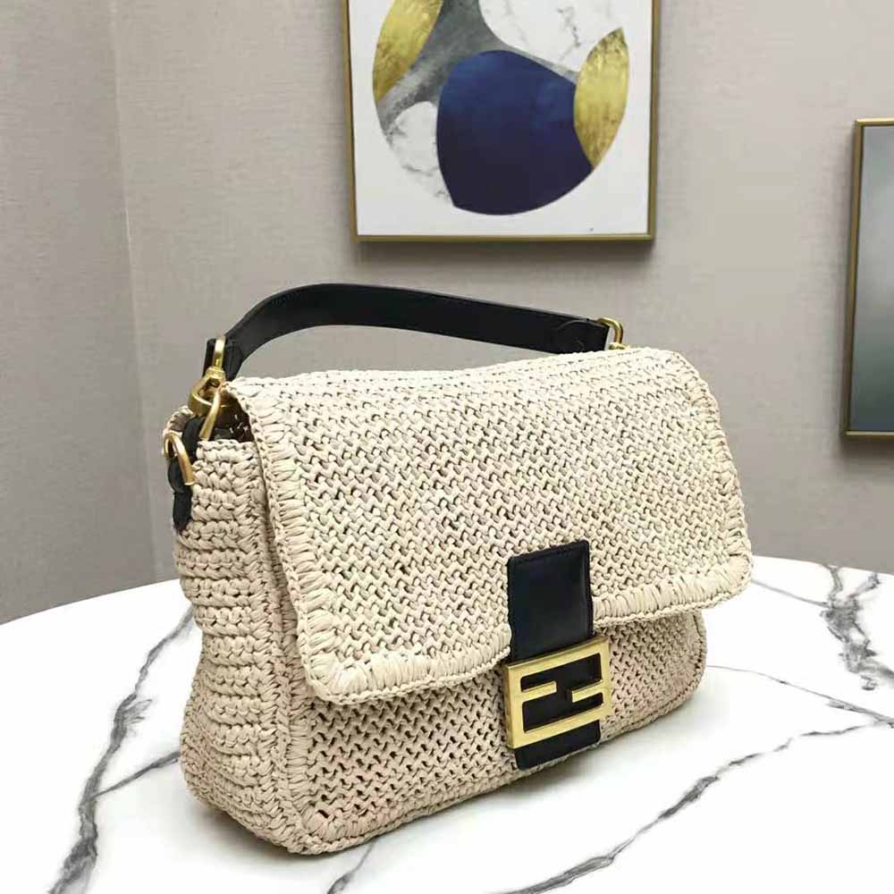 Side view showing baguette silhouette of Fendi Women Large Straw Bag