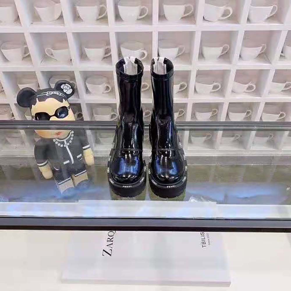 Close-up detail of glossy neoprene and hardware on Fendi Women Biker Boots