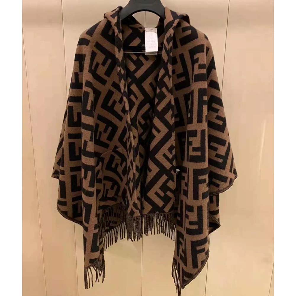Side angle showing the oversized fit of Fendi Women Brown Cashmere Poncho