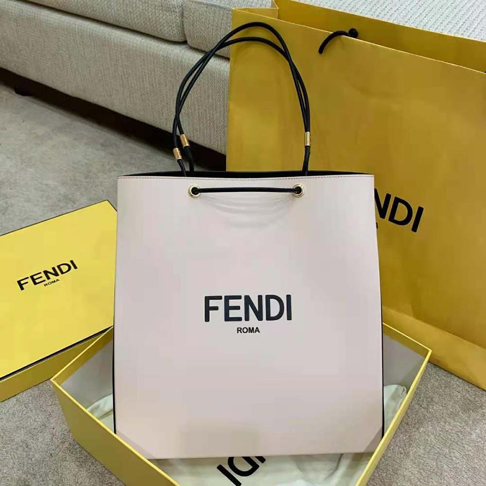 Close-up of pink leather and silver Fendi logo details on bag