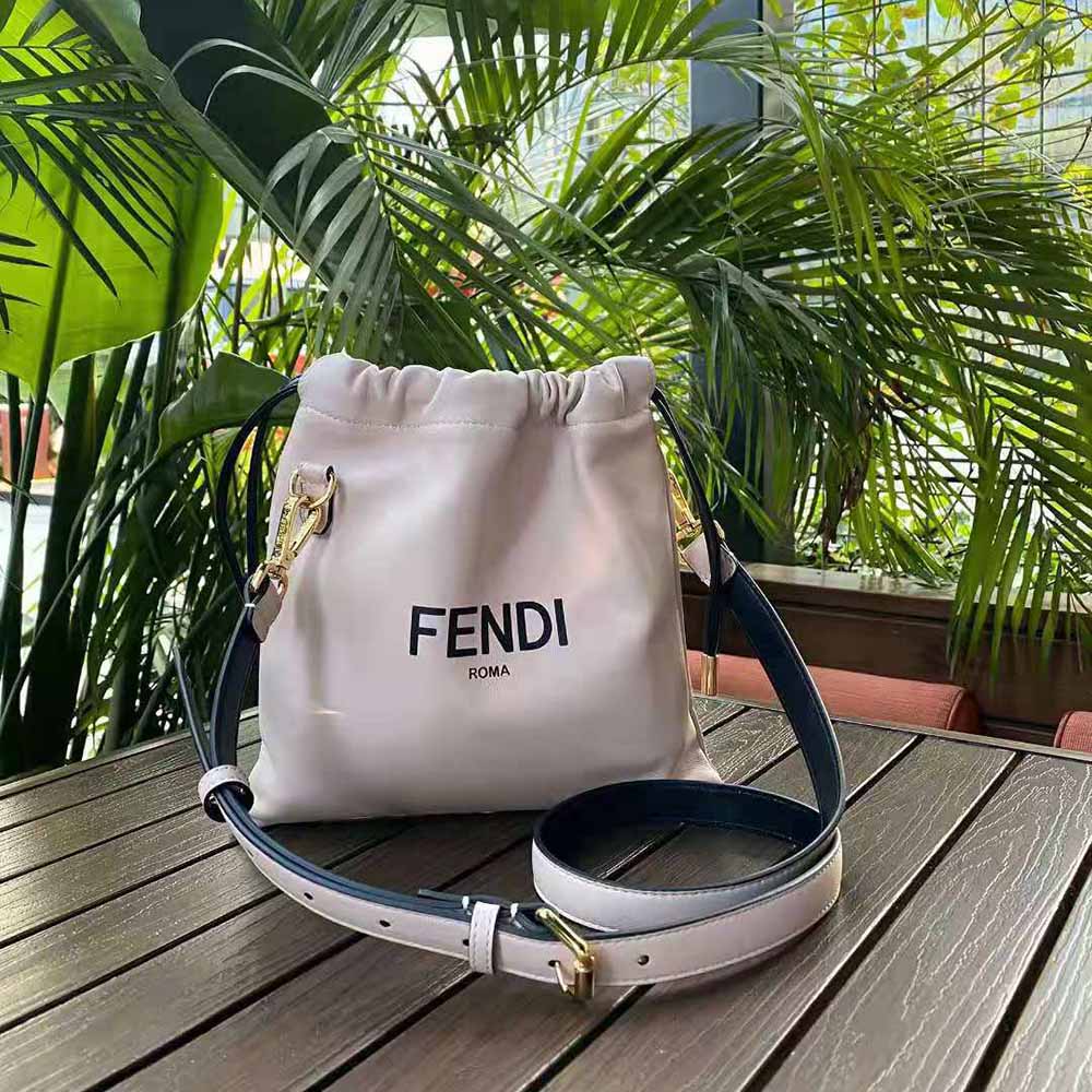 Close-up of gold-tone logo hardware on Fendi Pack Small Pouch