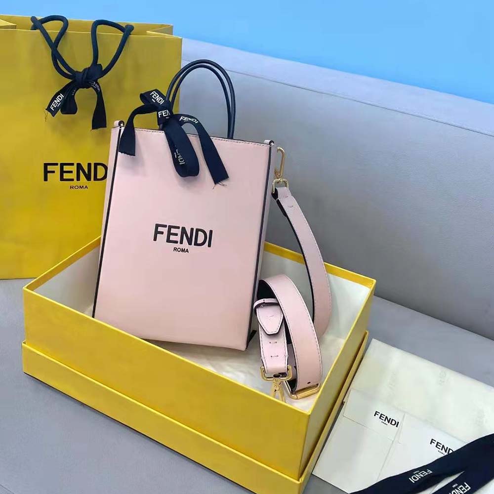 Close-up of gold Fendi hardware on pink leather bag