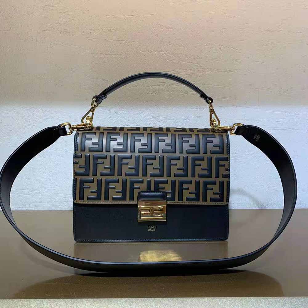 Side profile showing structured silhouette of Fendi Women Kan U Black Leather Bag