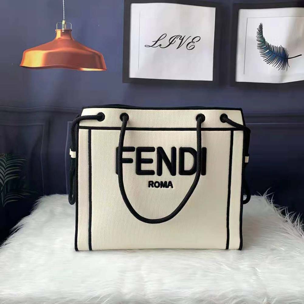 Close-up on gold-tone hardware and Fendi Roma logo on the shopper bag