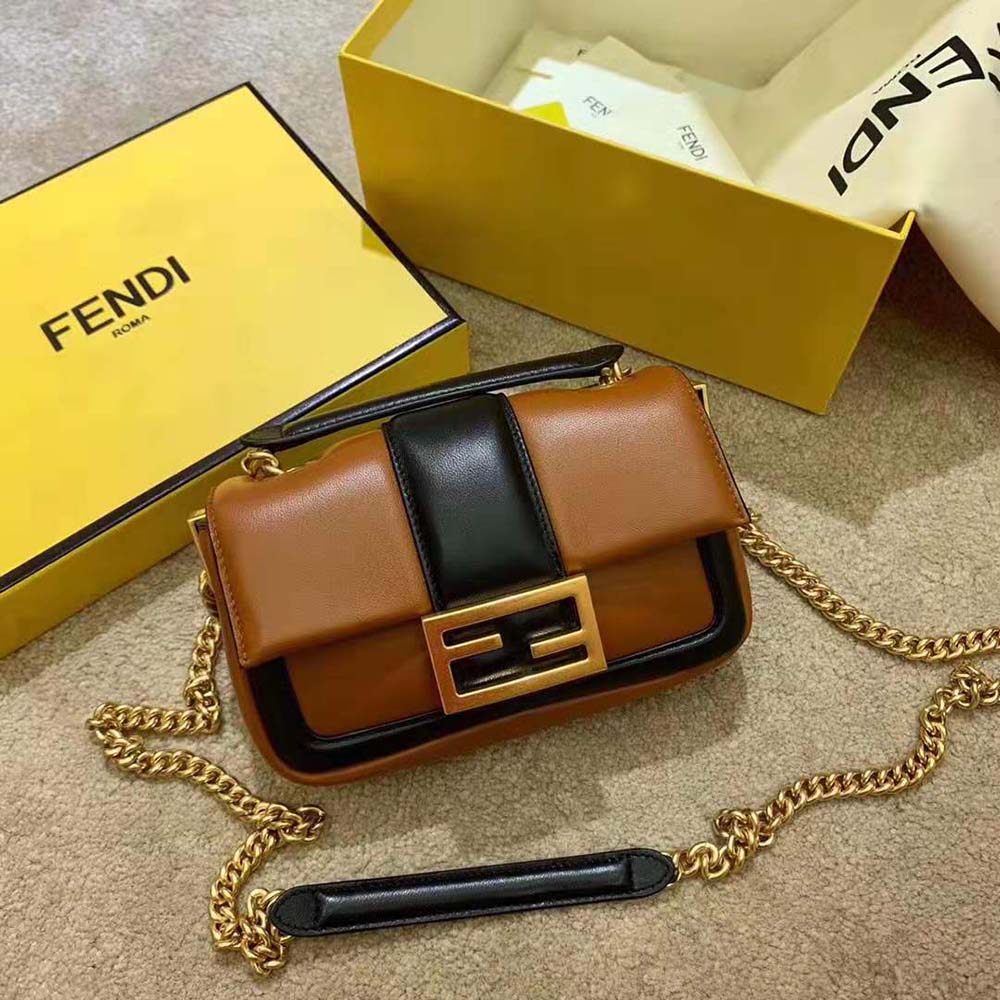 Close-up of gold chain and leather detail on Fendi Women Mini Baguette