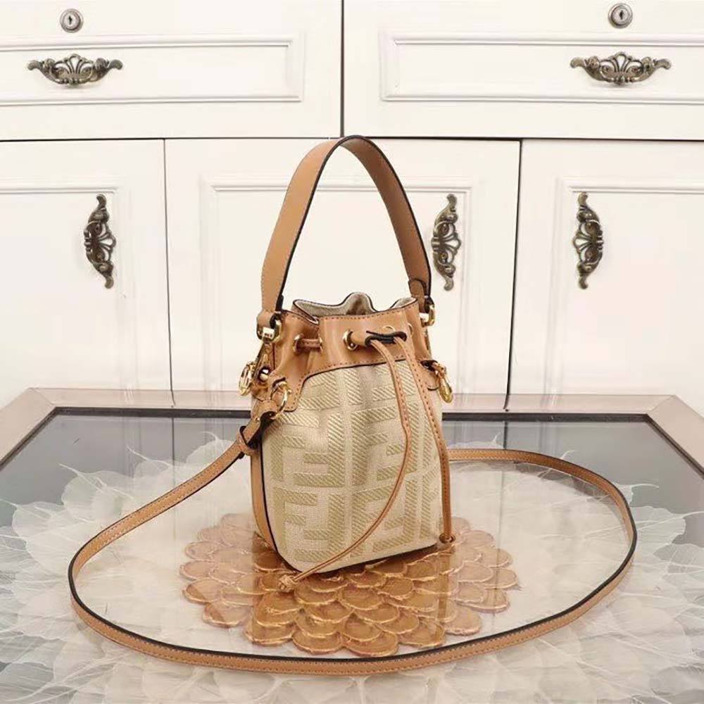 Close-up of gold-tone hardware on Fendi Women Mon Tresor Beige Raffia mini Bag