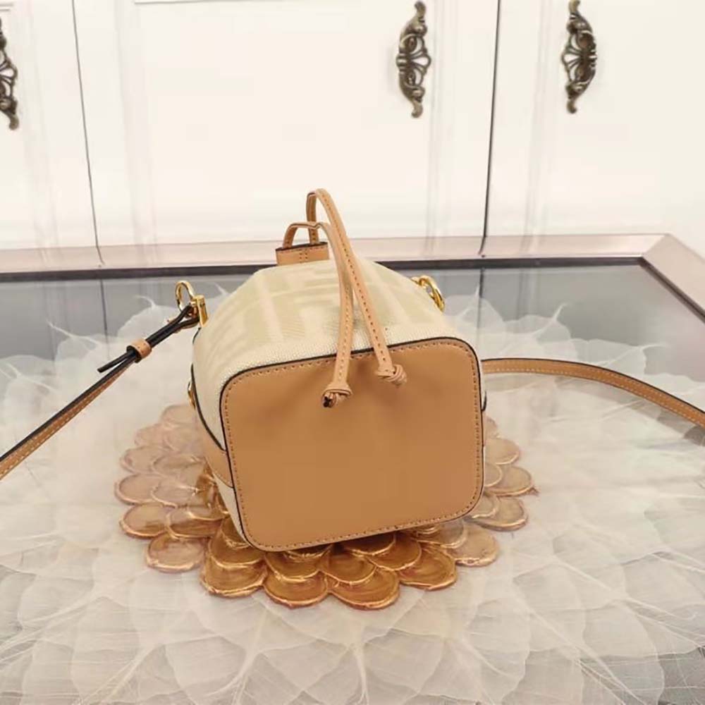 Side angle showing raffia texture and leather trim of Fendi Women Mon Tresor Beige Raffia mini Bag