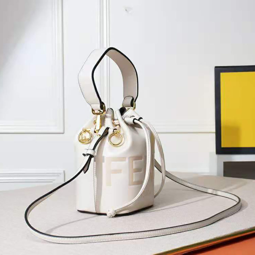 Side angle of Fendi Women Mon Tresor Leather Mini Bag-White with adjustable strap