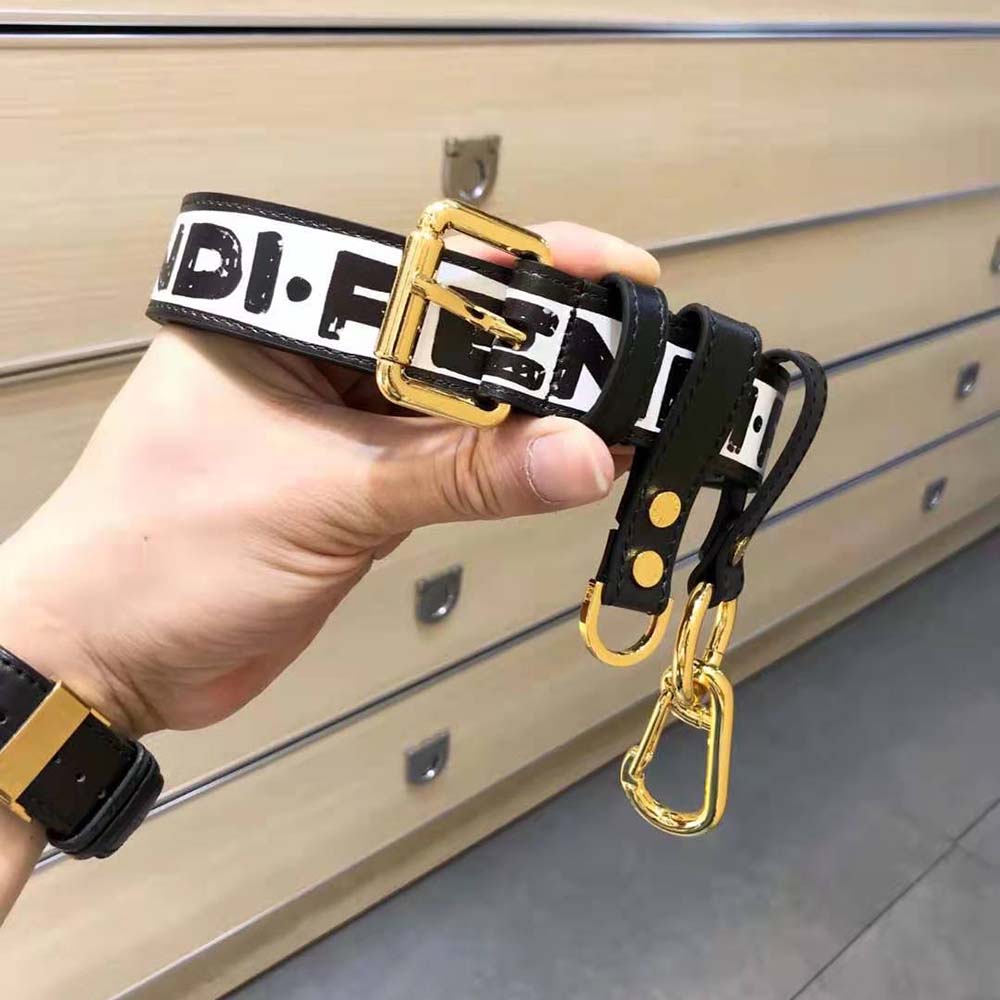 Close-up of gold-tone key ring and clip on Fendi Women Multi-accessorized Fendi Belt