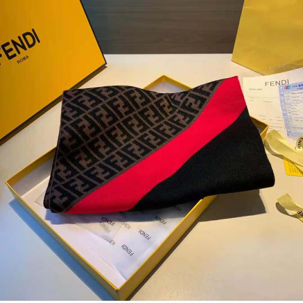 Close-up detail of signature Fendi logo on wool scarf in red
