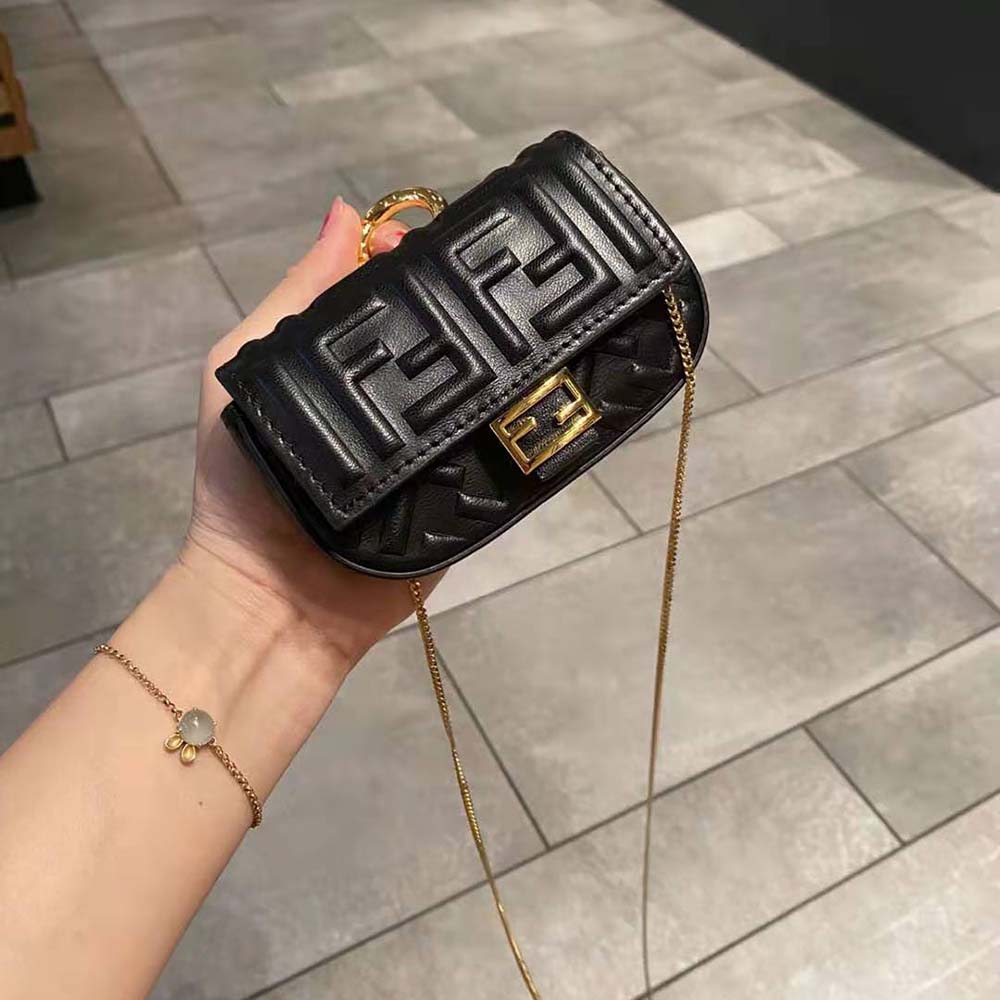 Side angle showing magnetic closure of Fendi Women Nano Baguette Charm