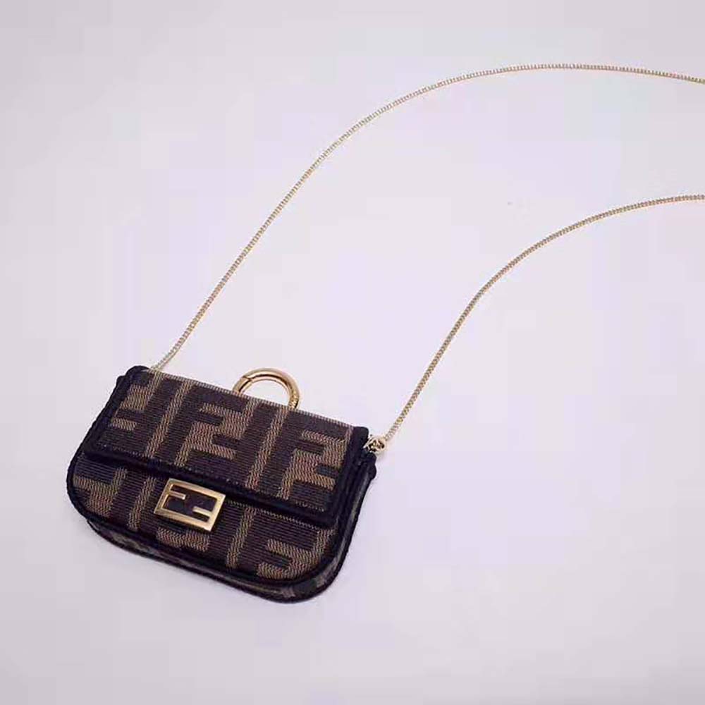 Close-up of gold-tone hardware on Fendi Women Nano Baguette Charm